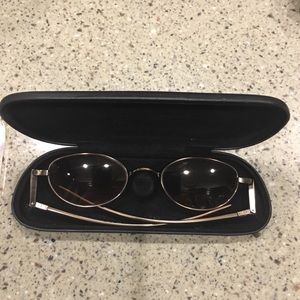 Donna Karan “John Lennon” style sunglasses.